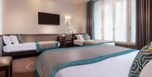 Habitación cuádruple del hotel Elysées Céramic. Foto 3