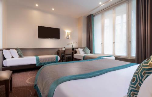Habitación cuádruple del hotel Elysées Céramic. Foto 10