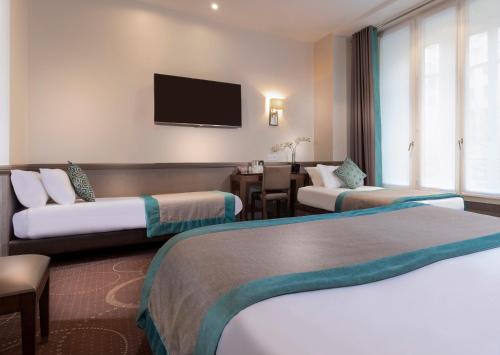 Habitación cuádruple del hotel Elysées Céramic. Foto 11
