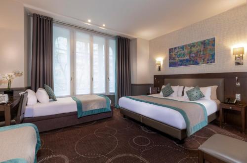 Habitación cuádruple del hotel Elysées Céramic. Foto 12