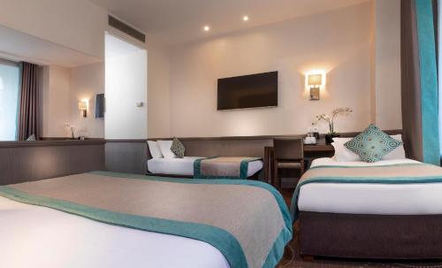 Habitación cuádruple del hotel Elysées Céramic. Foto 15