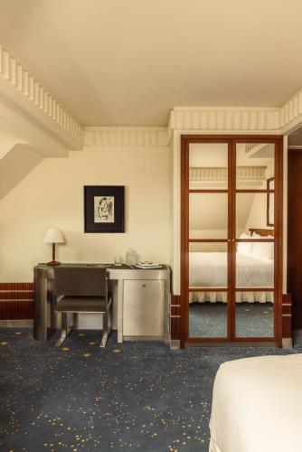 Habitación Deluxe del hotel Des Grands Voyageurs. Foto 4