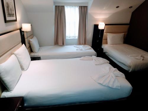 Habitación cuádruple del hotel Edward Paddington. Foto 6