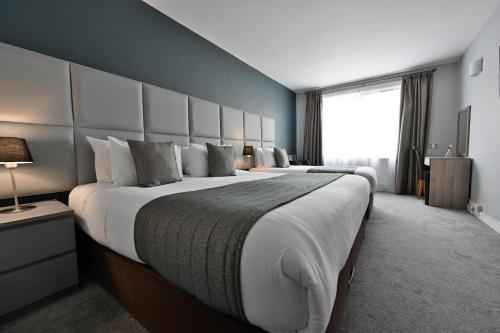 Habitación Triple del hotel Kensington Court