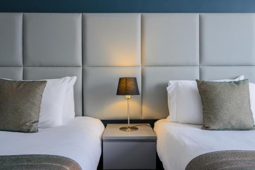 Habitación Triple del hotel Kensington Court. Foto 4