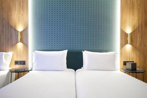 Habitación Triple del hotel Exe Mitre. Foto 1