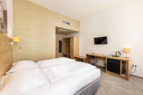Habitación Doble - 1 o 2 camas del hotel City Ring. Foto 4
