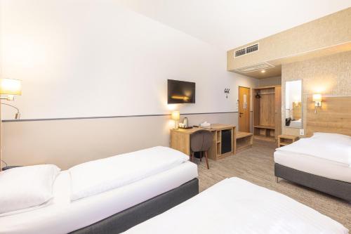 Habitación Triple con ducha del hotel City Ring