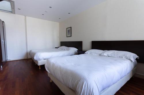 Habitación Cuádruple Estándar del hotel Hôtel Mimosa. Foto 9