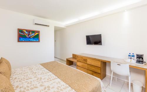 Habitación Doble Estándar con vistas al jardín del hotel Posada Real Puerto Escondido. Foto 3