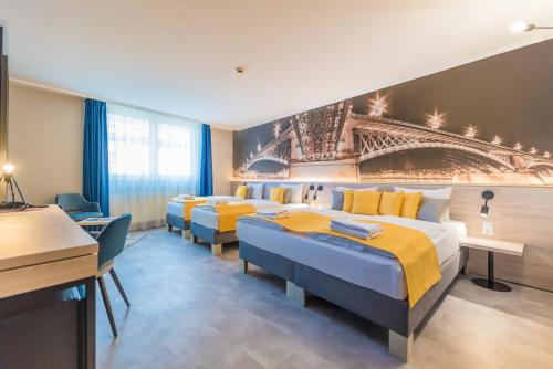 Habitación Cuádruple Confort del hotel Impulso by Mellow Mood Hotels. Foto 2