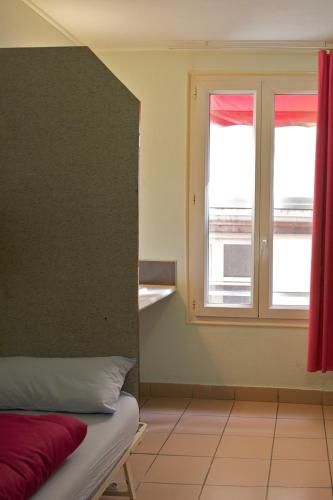 Habitación Triple con baño compartido del hotel Auberge Internationale Des Jeunes. Foto 4