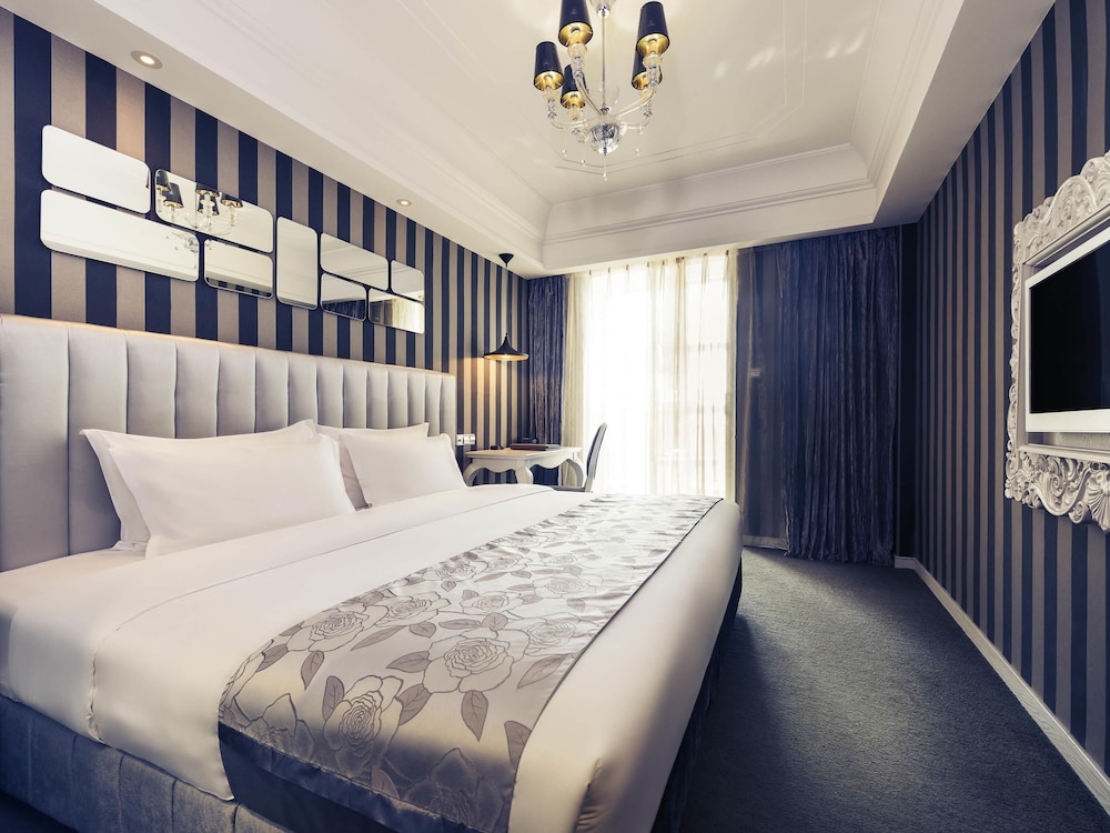 HABITACIÓN SUPERIOR con 1 cama king size del hotel Mercure Xiamen Exhibition Centre. Foto 3