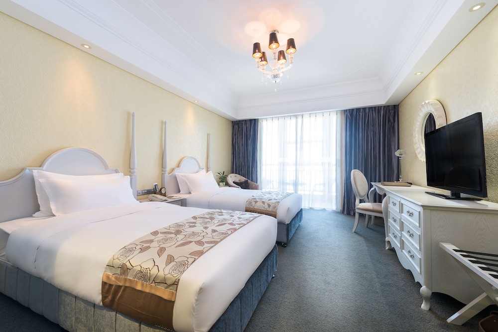 Habitación Deluxe con 2 camas individuales del hotel Mercure Xiamen Exhibition Centre. Foto 1