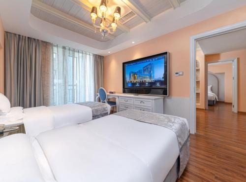 Habitación Familiar Clásica del hotel Mercure Xiamen Exhibition Centre. Foto 2