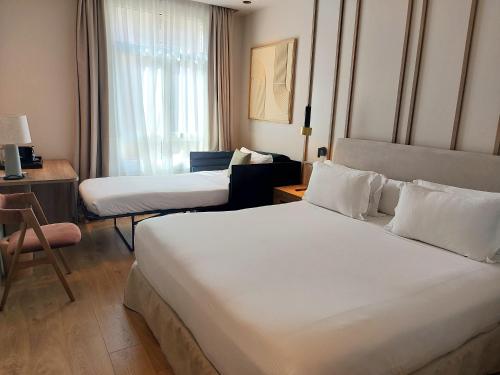 Habitación Superior del hotel H10 Puerta De Alcalá. Foto 8