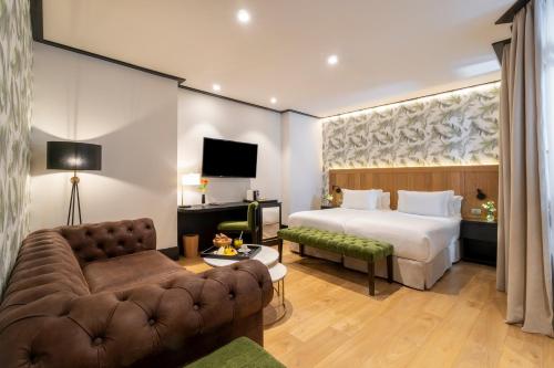 Habitación Cuádruple Deluxe del hotel H10 Puerta De Alcalá