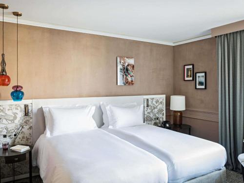 Habitación Individual de lujo con vistas al patio o a la Rue Scribe - 2 camas individuales del hotel Sofitel Le Scribe Paris Opéra. Foto 8