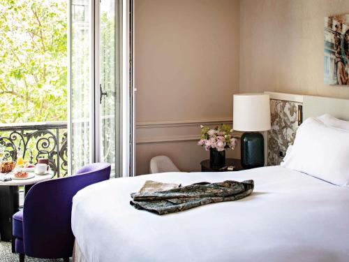 Habitación de lujo con vistas al patio o a la Rue Scribe - 1 cama grande del hotel Sofitel Le Scribe Paris Opéra. Foto 3
