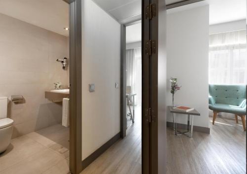 Habitaciones Familiares comunicadas del hotel Nh Madrid Zurbano. Foto 1