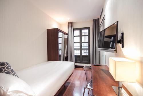 Habitación Individual del hotel Petit Palace Marques Santa Ana. Foto 1