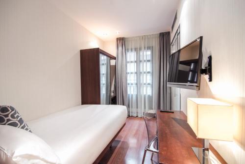 Habitación Individual del hotel Petit Palace Marques Santa Ana. Foto 2