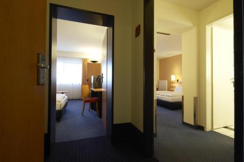 Habitación Familiar (2 adultos + 2 niños de hasta 12 años) del hotel Intercityhotel Frankfurt Airport
