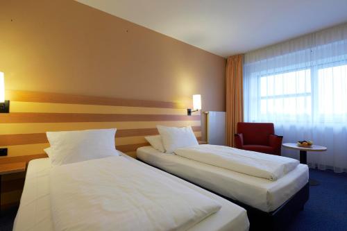 Habitación doble 2 Camas individuales del hotel Intercityhotel Frankfurt Airport. Foto 1