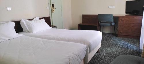 Habitación Doble - 2 camas del hotel Grand Hotel du Havre. Foto 1