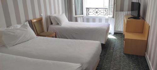 Habitación Triple del hotel Grand Hotel du Havre. Foto 1