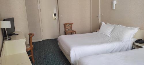 Habitación cuádruple del hotel Grand Hotel du Havre. Foto 2