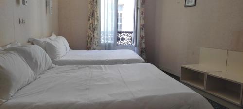 Habitación cuádruple del hotel Grand Hotel du Havre. Foto 3