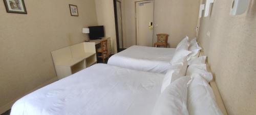 Habitación cuádruple del hotel Grand Hotel du Havre. Foto 8