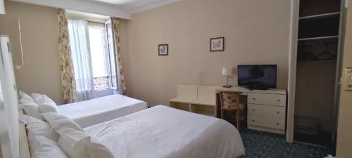 Habitación cuádruple del hotel Grand Hotel du Havre. Foto 10