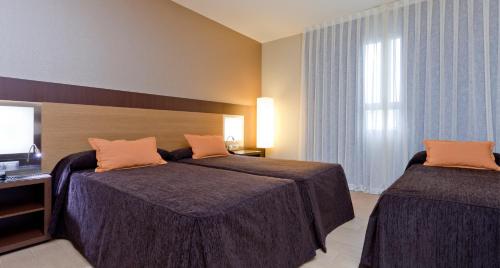 Habitación Triple del hotel Ciudad De Alcaniz. Foto 5