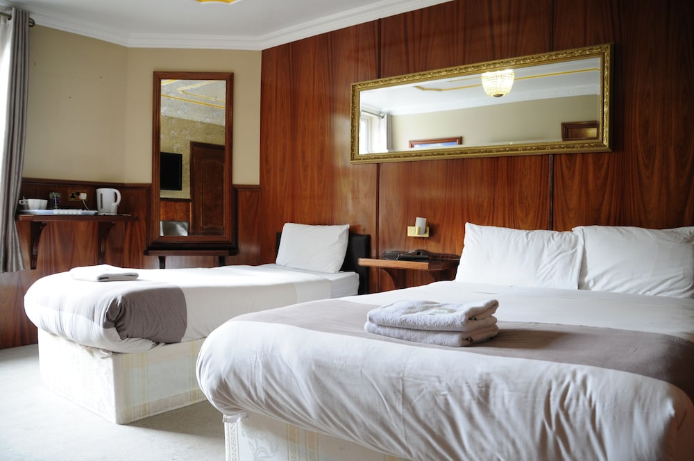 Habitación con 2 camas individuales del hotel Cricklewood Lodge. Foto 1