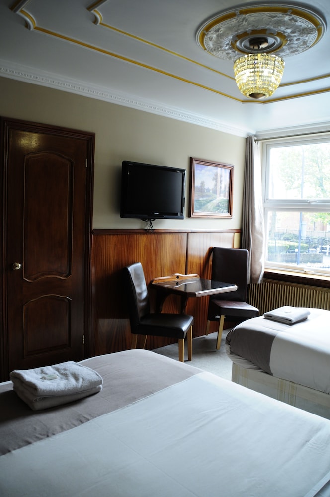 Habitación con 2 camas individuales del hotel Cricklewood Lodge. Foto 4