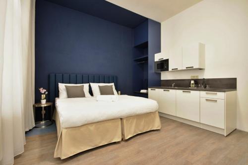 Junior suite 2 Camas individuales kitchenette del hotel Alveo Suites. Foto 1