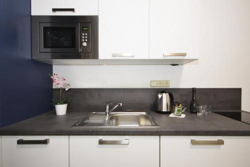 Junior suite 2 Camas individuales kitchenette del hotel Alveo Suites. Foto 3