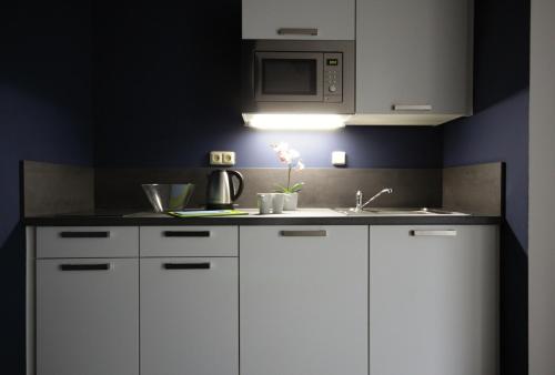 Junior suite 2 Camas individuales kitchenette del hotel Alveo Suites. Foto 12