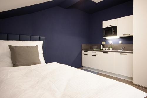 Junior suite 2 Camas individuales kitchenette del hotel Alveo Suites. Foto 13