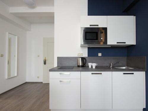 Junior suite 2 Camas individuales kitchenette del hotel Alveo Suites. Foto 21