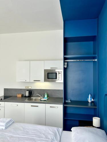 Junior suite 2 Camas individuales kitchenette del hotel Alveo Suites. Foto 29