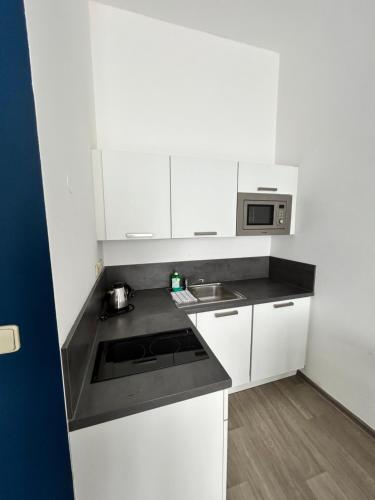 Junior suite 2 Camas individuales kitchenette del hotel Alveo Suites. Foto 33