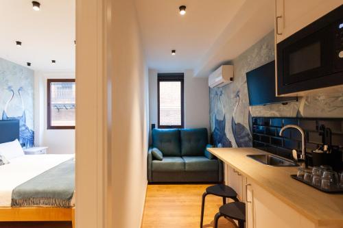 Habitación Triple Executive del hotel Welldone Sierpes Boutique. Foto 7