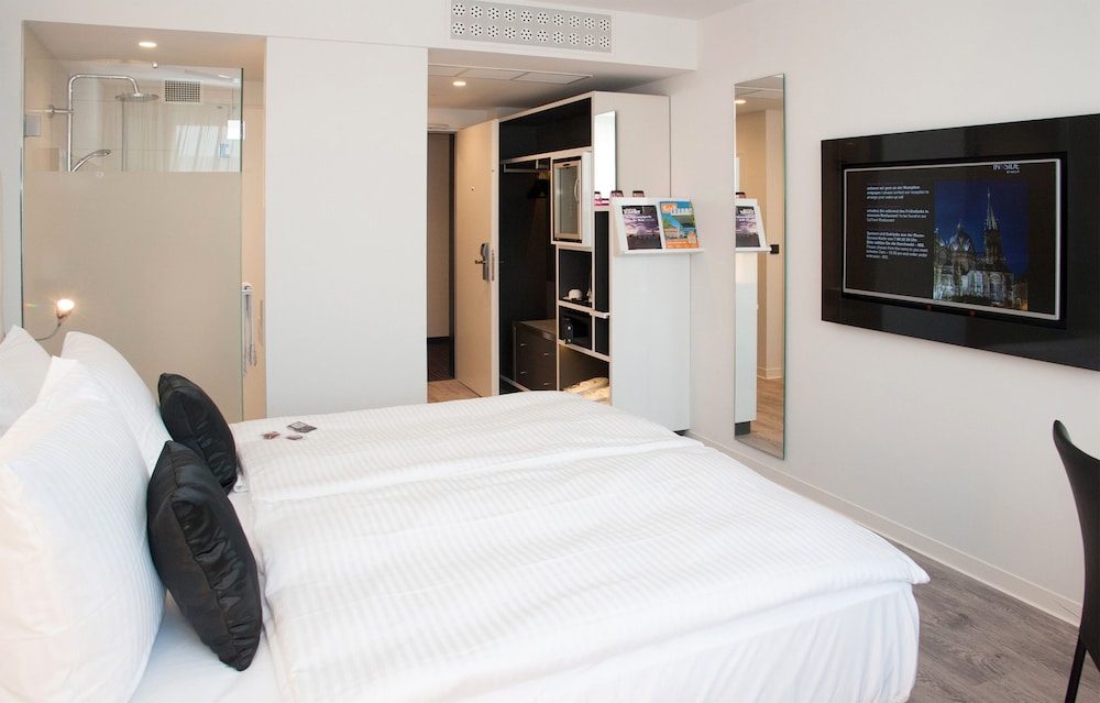 Habitación doble 1 Cama king Con Vistas 2 Camas individuales del hotel Innside By Meliá Aachen. Foto 1
