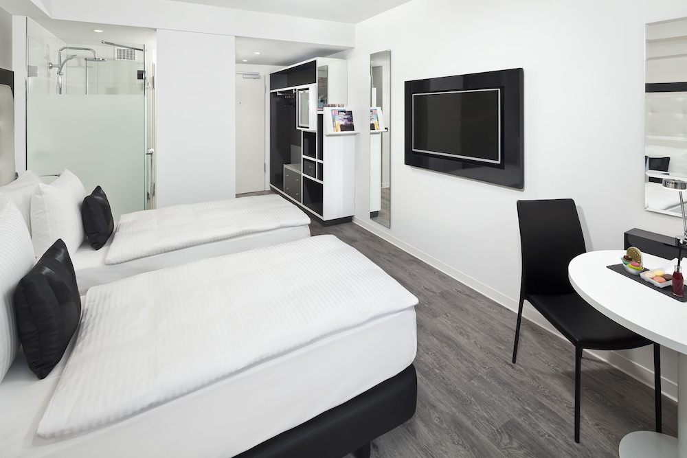 Habitación doble 1 Cama king Con Vistas 2 Camas individuales del hotel Innside By Meliá Aachen. Foto 3
