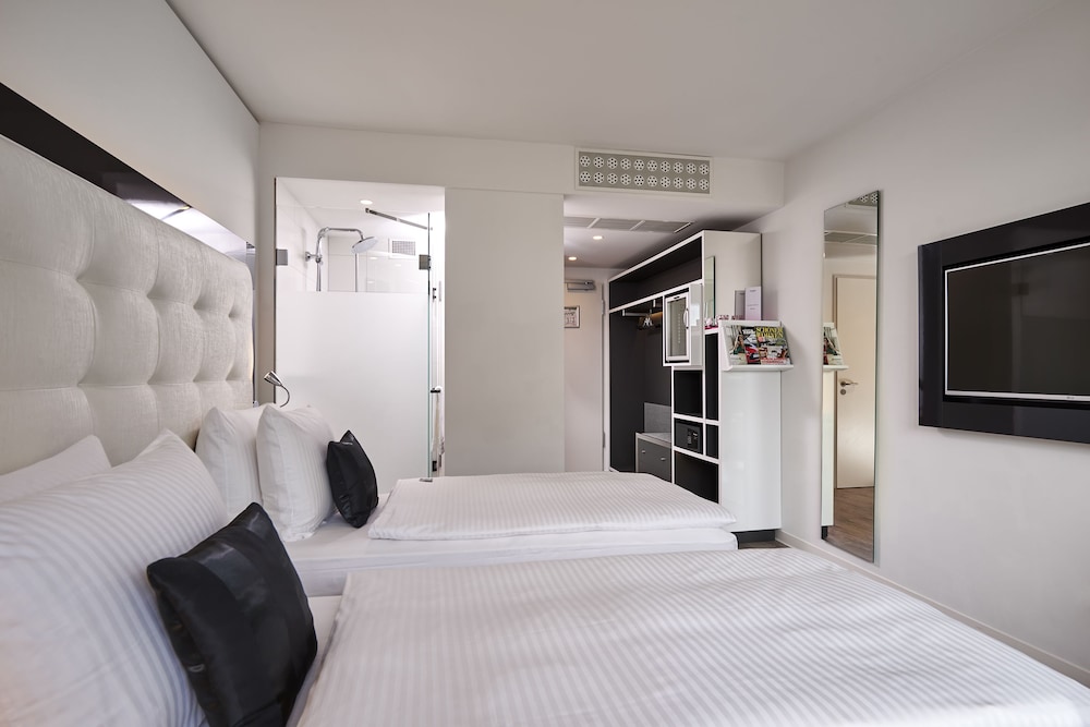 Habitación doble 1 Cama king Con Vistas 2 Camas individuales del hotel Innside By Meliá Aachen. Foto 11