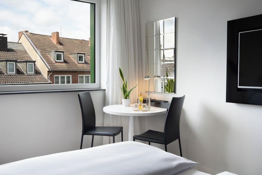 Habitación doble Premium Con Vistas 2 Camas individuales 1 Cama doble del hotel Innside By Meliá Aachen. Foto 3