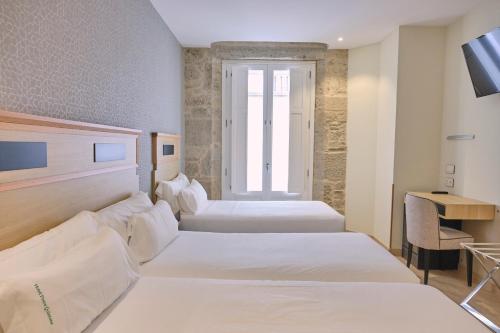 Habitación Doble con Cama supletoria del hotel Praza Quintana